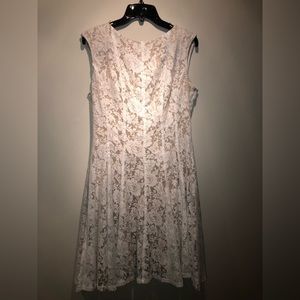 Knee-length, white lace overlay, swing dress